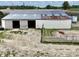 A spacious barn with an open entryway and large pastures offering versatile use for storage at 2868 S 525 W, Trafalgar, IN 46181