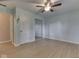 Well-lit bedroom features a ceiling fan, closet, and wood flooring at 2868 S 525 W, Trafalgar, IN 46181