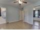 Bright bedroom featuring an ensuite bathroom, closet with mirrors, and wood flooring at 2868 S 525 W, Trafalgar, IN 46181
