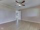 Bedroom featuring ceiling fan, light wood floors, and a connecting door to an adjoining space at 2868 S 525 W, Trafalgar, IN 46181