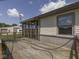 Exterior deck view showcases a satellite dish, siding and a barn in the distance at 2868 S 525 W, Trafalgar, IN 46181