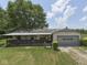 Home with a covered porch and an attached garage, with a blue sky and white clouds above at 2868 S 525 W, Trafalgar, IN 46181