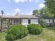 Rear exterior view of home showing the screened-in porch, yard and landscaping at 2868 S 525 W, Trafalgar, IN 46181