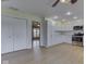 Open concept kitchen with white cabinets and stainless steel appliances and wood flooring at 2868 S 525 W, Trafalgar, IN 46181