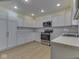Well-lit kitchen featuring updated stainless steel appliances and bright countertops at 2868 S 525 W, Trafalgar, IN 46181