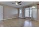 Living room features ceiling fan, light wood floors, and front door access at 2868 S 525 W, Trafalgar, IN 46181