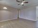 Spacious living room with ceiling fan, light wood floors, and neutral paint at 2868 S 525 W, Trafalgar, IN 46181