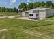 Large outbuilding with fenced area and trailer at 2868 S 525 W, Trafalgar, IN 46181
