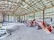 Outbuilding interior featuring tractor and open ceiling at 2868 S 525 W, Trafalgar, IN 46181