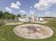 Outbuilding with fenced area, trailer, and circular slab at 2868 S 525 W, Trafalgar, IN 46181
