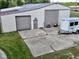 Large outbuilding with two garage doors and concrete pad at 2868 S 525 W, Trafalgar, IN 46181