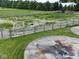 Fenced pasture with a sandy base, featuring dual concrete pads for livestock management at 2868 S 525 W, Trafalgar, IN 46181