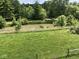 Scenic view of a serene pond surrounded by vibrant greenery and lush vegetation at 2868 S 525 W, Trafalgar, IN 46181