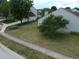 Spacious backyard featuring a well-manicured lawn and mature trees, providing a serene outdoor space at 291 Lakemoore St, Brownsburg, IN 46112