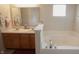 Bathroom featuring double sinks and a large soaking tub at 291 Lakemoore St, Brownsburg, IN 46112