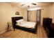 Cozy bedroom with ceiling fan and comfortable bed, complemented by a side table and dresser at 291 Lakemoore St, Brownsburg, IN 46112