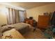 Comfortable bedroom with neutral color scheme, natural light, and wood-look flooring at 291 Lakemoore St, Brownsburg, IN 46112