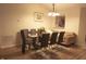 Elegant dining area with a glass table, seating for six, and a cozy atmosphere at 291 Lakemoore St, Brownsburg, IN 46112