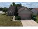 Aerial view of a well-maintained home featuring a two-car garage and mature landscaping at 291 Lakemoore St, Brownsburg, IN 46112
