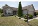 Inviting home with lush landscaping, a well-maintained lawn, and a cozy front porch at 291 Lakemoore St, Brownsburg, IN 46112