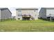 Large, grassy backyard featuring a deck and stairs, providing an ideal space for relaxation and entertainment at 3969 Canning St, Danville, IN 46122