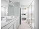 This bathroom features a double sink vanity, a glass shower, and a walk-in closet at 3969 Canning St, Danville, IN 46122
