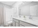 Well-lit bathroom with a double vanity, quartz countertop, and a shower-tub combination with neutral tones at 3969 Canning St, Danville, IN 46122