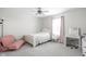 Bright bedroom with a single bed, vanity area, and a cozy beanbag chair for relaxation at 3969 Canning St, Danville, IN 46122