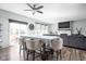 Dining space with table, four chairs, and natural light, connecting to the living room and kitchen at 3969 Canning St, Danville, IN 46122