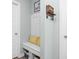 Inviting entryway with built-in bench seating, storage baskets, and stylish wall decor for a welcoming atmosphere at 3969 Canning St, Danville, IN 46122