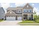 Charming two-story home with brick accents, a well-manicured lawn, and a spacious two-car garage at 3969 Canning St, Danville, IN 46122