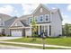 Beautiful two-story home with brick and siding, showcasing a well-maintained front yard and inviting curb appeal at 3969 Canning St, Danville, IN 46122