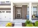 Inviting front porch with brick columns, stylish seating, and a welcoming wreath on the front door at 3969 Canning St, Danville, IN 46122