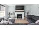 Cozy living room featuring a fireplace, comfortable seating, stylish decor, and natural light at 3969 Canning St, Danville, IN 46122