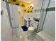 Well-lit bathroom featuring walk-in shower, stylish tiling, and sunflowers on wall at 4049 Zinfandel Way, Indianapolis, IN 46254