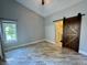 Spacious bedroom with ample natural light and an en-suite bathroom through barn door at 4049 Zinfandel Way, Indianapolis, IN 46254
