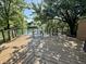 Picture of backyard deck with lake view, picnic table, railing, and mature trees at 4049 Zinfandel Way, Indianapolis, IN 46254