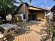 Home exterior with deck, wooden siding, and picnic table, great for outdoor entertaining at 4049 Zinfandel Way, Indianapolis, IN 46254