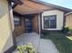 Inviting entryway featuring a well-lit porch and a walkway lined with greenery at 4049 Zinfandel Way, Indianapolis, IN 46254