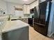 Updated kitchen boasting granite countertops, tile backsplash, stainless steel appliances, and ample storage space at 4049 Zinfandel Way, Indianapolis, IN 46254