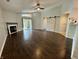 Bright living room featuring a cozy fireplace, wood floors, sliding glass door and a sliding barn door at 4049 Zinfandel Way, Indianapolis, IN 46254