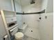 Modern tiled walk-in shower with a built-in bench and glass enclosure for a clean look at 4049 Zinfandel Way, Indianapolis, IN 46254