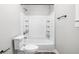 Bright bathroom featuring a shower-tub combo and a functional layout at 413 E Caven St, Indianapolis, IN 46225