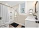 Cozy bathroom featuring a shower and tub, stylish vanity, and modern fixtures at 413 E Caven St, Indianapolis, IN 46225