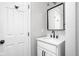 Bathroom featuring a vanity, framed mirror, and modern fixtures at 413 E Caven St, Indianapolis, IN 46225