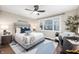 Well-lit bedroom with large windows, features a comfortable bed, stylish decor, and a cozy workspace at 413 E Caven St, Indianapolis, IN 46225