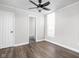 Bedroom featuring hardwood floors, natural light, and a view to the bathroom at 413 E Caven St, Indianapolis, IN 46225