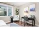 Stylish home office featuring a modern desk, comfortable chair, and natural light at 413 E Caven St, Indianapolis, IN 46225