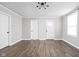Spacious living room featuring sleek flooring, neutral walls, and updated lighting fixtures at 413 E Caven St, Indianapolis, IN 46225