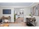 Stylish living room, providing open access to the kitchen and dining area, bathed in natural light at 413 E Caven St, Indianapolis, IN 46225